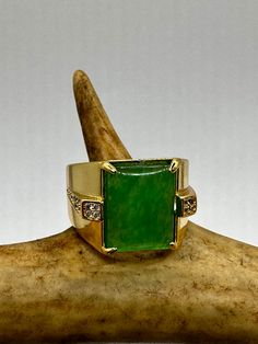 vintage green fun jade ring  Setting is a golden finished bronze setting  This is one of my hand re finished treasures. Salvaged from vintage.  Size   9.5 Re sizing can be done for a $20 fee and may take up to a week.  Engraving is $4 per letter.  Thank you for supporting a veteran's small business. All jewelry is shipped free within the US in a stylish gift box  PLEASE NOTE If we have multiples of the same vintage item, it is because we often purchase factory remnants or odd lots. Likewise, if Antique Green Ring With 17 Jewels, Vintage Gold Rectangular Emerald Ring, Antique Gold Emerald Ring As Gift, Vintage Rectangular Emerald Ring Gift, Antique Green Rings For Gifts, Antique Green Ring As A Gift, Vintage Jade Gemstone Jewelry, Collectible Yellow Gold Jade Jewelry, Antique Green Ring As Gift