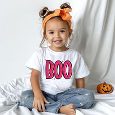 Bright Boo Shirt Halloween Boo Shirt Cute Boo Shirt Pink and Orange Boo Shirt, Halloween Boo, Pumpkin Shirt, Happy Halloween, Halloween Gift Introducing our whimsical BOO-Shirt! This charming tee features the word BOO in bright pink with a cute orange outline.  This shirt is ready to spread Halloween cheer in the sweetest way.   Made from soft, high-quality cotton, this t-shirt ensures both comfort and style.  Perfect for Halloween lovers and those who appreciate a unique twist on the spooky sea Playful Pre-shrunk Tops For Halloween, Playful Cotton Tops For Halloween, Fun Halloween Short Sleeve Shirt, Fun Halloween Shirt With Character Print, Cute Halloween Short Sleeve Shirt, Halloween Playful Short Sleeve T-shirt, Cute Cotton Halloween Shirt, Cute Short Sleeve Halloween Shirt, Playful Short Sleeve T-shirt For Halloween