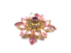 *Description: Exquisite pink rhinestone and pink and white art glass floral brooch on a gold plated filigree backing with dog-toothed prongs from the 1960s.  This beautiful brooch has a domed center and the pink rhinestone on top.  The second layer is the filigree gold plating and the bottom, third layer, is a combination of crystal petals in pink rhinestones and white and pink art glass rhinestones; dog-toothed prong set.  This is a beautifully designer brooch, however, unsigned, as one of the Designer Brooch, Floral Brooch, Rhinestone Art, Old Fashioned Christmas, Pink Art, Paper Tags, Pink Rhinestones, Gorgeous Jewelry, Glass Domes