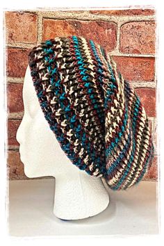 This hat was created with a medium-weight multicolor yarn.  It is worked in the round, from top to bottom.  This pattern provides instructions for four different adult sizes; small, medium, large, and extra-large.  Depending on the size of the hat, you will use approximately 3/4 skeins to 1 1/2 skeins of yarn and it will take approximately 4 1/2 - 6 1/2 hours to complete. Crochet Beanie Patterns With Yarn, Crochet Beanie Patterns In Yarn, Multicolor Slouchy Crochet Hat, Multicolor Crochet Slouchy Hat, Hand Knitted Multicolor Slouchy Crochet Hat, Knitted Yarn Beret One Size, Multicolor Yarn Hat For Fall, Multicolor Slouchy Crochet Hat For Fall, Slouchy Multicolor Crochet Hat For Fall