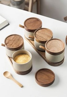 wooden bowls and spoons on a white table