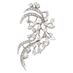 Introducing an exquisite piece of jewelry that seamlessly blends elegance and versatility: a pendant cum brooch adorned with a stunning array of diamonds. This masterpiece features 5.36 carats of dazzling white round diamonds, complemented by 12 sparkling white marquise diamonds totaling 1.85 carats. Expertly crafted in 18k white gold, it weighs 10.68 grams, ensuring a perfect balance of luxury and comfort. Whether worn as a pendant or a brooch, this beautiful piece radiates sophistication and charm, making it an essential accessory for any occasion. Its timeless design and brilliant sparkle will elevate any outfit, making you the center of attention at every event. Indulge in the unparalleled beauty and craftsmanship of this pendant cum brooch, a true testament to fine jewelry artistry. Luxury White Elegant Brooches, Hair Pendant, Diamond Hair, Ruby Pendant, Rose Pendant, Charm Making, Outfit Making, Modern Necklaces, Key Pendant