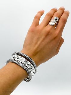 "DON 925's master silversmiths handcrafted this beautiful cuff bracelet with genuine sterling silver. It features a woven design with oxidized details. It is flexible and can be easily adjusted for better fit. Inner length (end to end): 14.5 cm (5.70\") Width: 2.9 cm (1.15\") Weight: 66.1 grams (2.33 oz) Stamped with \"925\" the quality hallmark. Place of origin Taxco, Mexico (the silver city). ★Premium DON925 bag included ★FAQ'S: www.etsy.com/shop/don925#faq ★Instagram: @don925newyork ★About us Silver Prom Jewelry, Silver Wedding Anniversary Gift, Silver Braided Bracelet, Bracelet Mexican, Chunky Silver Bracelet, Mexican Silver Jewelry, Chunky Silver Rings, Silver City, Woven Bracelet