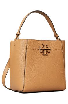 A stacked-T logo appliqué and a line of running stitches detail this pebbled-leather bucket bag that can be slung on the shoulder or across the body. Style Name:Tory Burch Mcgraw Small Leather Bucket Bag. Style Number: 6097593. Tory Burch Quadrant Tote, Tan Pebbled Leather Top Handle Bag, Tan Satchel Bucket Bag With Detachable Handle, Tan Bucket Bag With Removable Pouch, Tan Shoulder Bucket Bag, Tan Bucket Bag With Removable Pouch And Double Handle, Tan Bucket Shoulder Bag With Detachable Strap, Tan Shoulder Bucket Bag With Detachable Strap, Tan Tote Bucket Bag With Detachable Handle