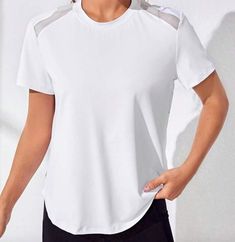 WOW...this T-Shirt is just WAY TOO COOL! Mesh cutouts with a flattering design in back...it is just so comfortable to play a round in or just work out in! Comes in Black or White. We LOVE this t-shirt! 85% Polyester, 15% Elastane Round Neck Medium Stretch Contrast Mesh, Cut Out Imported Summer Crew Neck T-shirt For Light Exercise, Athleisure Short Sleeve Crew Neck Top For Workout, Stretch Crew Neck T-shirt For Light Exercise, White Sporty T-shirt For Light Exercise, Sporty Stretch Short Sleeve Workout Top, Sporty Stretch Short Sleeve Top For Workout, Sporty Short Sleeve Tops For Light Exercise, White Casual Tops For Light Exercise, White Crew Neck Workout Tops