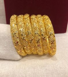 Christmas Gift, Holiday Gift,  24k gold plated Bangles, Indian Bridal Bangles, Handmade Bracelet for Women Gold Bangles for Women - Indian Bridal Bangles - Handmade Bracelet These stylish bangles feature a classic bangle design and are available in gold color. ▶ BEAUTIFUL HINGED GOLD BRACELET ▶ HIGED TO OPEN WIDE----- STAYS SECURELY SHUT -----  LIFT TAB SIDE TO OPEN Material: High quality 24k gold plated bangles ( Not solid gold) Diameter: 2.36 inches Can open Lead & Nickel free Tarnish resistan Traditional Festive Christmas Jewelry, Traditional Christmas Festive Jewelry, Gold Plated Bangle Bracelet As Gift, Gold Christmas Festive Bracelets, Traditional Christmas Celebration Jewelry, Festive Gold Bangle Bracelets, Traditional Gold Plated Bangle Gift, 22k Gold Bracelets For Celebration, Festive Gold Plated Bracelets As Gift