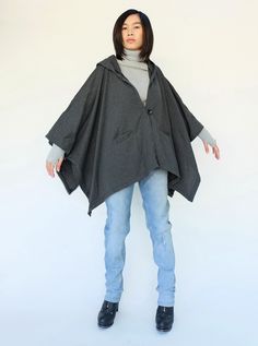 "🚚..ALL ORDERS ARE SHIPPED VIA DHL EXPRESS MAIL Dreamy, poncho style layer. Oversized and effortless, with a hoodie. Features a front pockets and button closures at front and side. Continue to enjoy perfect outdoor days after the temperature turns a little chilly. * Hooded; Button closure * Open sides with button closure * Two front pockets * Oversize, cozy silhouette * Unlined Measurements approximately: Sleeve Length (from side of neckline): 23\" (58 cm) Bust: 48\" (122 cm- all around) Approx Oversized Hooded Cape For Cold Weather, Gray One Size Fall Cape, Oversized Gray Cape For Fall, Gray Oversized Cape Outerwear, Oversized Gray Cape Outerwear, Casual One-size Cape For Cold Weather, Casual One Size Cape For Cold Weather, Oversized Gray Poncho For Fall, Fall Lagenlook Cape Outerwear