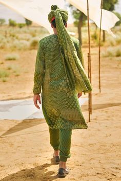 Kacha aam kurta with mix of multi patterned bandhani print. Comes with matching joggers pant.
Components: 2
Pattern: Printed
Type Of Work: Bandhani
Neckline: Notched
Sleeve Type: Long
Fabric: Satin Silk
Color: Green
Other Details: 
Elasticated sleeve and joggers hem
Note: Safa/turban worn by the model is not for sale
Occasion: Mehendi and Puja,Sangeet - Aza Fashions Festive Multicolor Lawn Suit With Bandhani Print, Traditional Chanderi Lawn Suit With Bandhani Print, Green Bandhani Print Churidar For Festivals, Festive Bandhani Print Lawn Suit, Traditional Bandhani Print Lawn Suit, Bollywood Style Bandhani Print Festive Lawn Suit, Traditional Lawn Suit With Bandhani Print, Bollywood Style Bandhani Print Lawn Suit For Diwali, Festive Lawn Suit With Bandhani Print