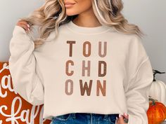 "Touchdown Sweatshirt, Football Sweatshirt, Cute Football Shirt, Football Shirt, Fall Sweater, Game Day Shirt, Mom Football Shirt ---How To Place Your Order--- Take a moment to carefully review all the product photos. Select your desired sweatshirt/ t-shirt size and color. (If you want this design to be placed on Hoodie, Please message me on etsy and we can come up with design very quickly) Click the \"Add to Cart\" button. You can always return to add more products to your order. Once you're re Fall Fan Gear Sweatshirt With Graphic Print, Fall Fan Gear Graphic Sweatshirt, Fan Gear Graphic Print Sweatshirt For Fall, Fall Fan Gear Tops With Lettering, Fall Sports Fan Sweatshirt With Graphic Print, Game Day Fall Crew Neck Sweatshirt, Graphic Print Sweatshirt For Game Day In Fall, Fall Game Day Crew Sweatshirt, Game Day Crew Sweatshirt For Fall