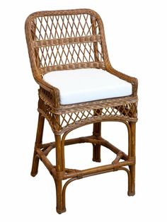 a wicker chair with a white cushion