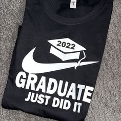 a black t - shirt with the words graduate just did it on it and a graduation cap