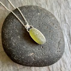 Chunky Olive Green Sterling Silver Sea Glass Pendant NecklaceThis is a sterling silver olive green sea glass necklace that would make a perfect gift for a friend or relative who is hard to buy for. Do you need a great gift for your mom or grandma? This pretty necklace is the perfect gift for someone you love or to wear to a beach wedding! Here are the details: It is a piece of olive green sea glass, that is set in a scalloped bezel with a simple bail. And, it will arrive to you on either a 16” o Round Sea Glass Jewelry Gift, Sea Glass Round Necklace As Gift, Round Sea Glass Necklace As A Gift, Round Sea Glass Necklace For Gift, Minimalist Recycled Glass Necklaces For Gifts, Minimalist Recycled Glass Jewelry For Gifts, Natural Stone Necklaces With Recycled Glass For Gifts, Natural Stones Necklace With Recycled Glass For Gifts, Elegant Handmade Sea Glass Necklace