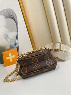 The Utility Phone Sleeve in Monogram canvas is an on-trend, multi-tasking bag for life on the go. It adapts to different sizes of smartphone and can also hold essentials like cards, cash or keys in its secure, zipped pockets. Both the adjustable canvas strap and the metal chain are removable and offer multiple carry options. Detailed Features 16 x 19 x 6 cm (Length x height x width ) Monogram coated canvas Natural cowhide-leather trim Textile lining Gold-color hardware Zip closure Outside zipped pocket Zipped front pocket Hook on the strap Strap: Removable, adjustable Strap Drop: 36.0 cm Strap Drop Max.: 55.0 cm Chain: Removable Chain Drop: 21.0 cm Somali, Sierra Leone, New Bag, Monogram Canvas, Metal Chain, Cowhide Leather, For Life, Bottega Veneta, Leather Trims