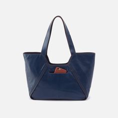 Designed to go from days at the office to weekend adventures, this structured tote pairs style with function. Navy Tote Bag, Weekend Adventures, Leather Artisan, Antique Brass Hardware, Gold Ounce, Honey Brown, Fly London, Medium Tote, Navy Leather