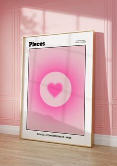 a pink poster with a heart in the center on a wooden floor against a pink wall