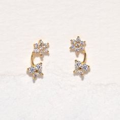 Be transported to a mystical garden in the 14k Fine Garden Party Stud Earrings. We love the dainty design and sparkly stones. Make these your go-to studs! Delicate Sparkling Stone Earrings For Anniversary, Delicate Earrings With Sparkling Stones For Anniversary, Sparkling 14k Gold Fine Jewelry Earrings, 14k Gold Earrings With Sparkling Stones, Dainty Cubic Zirconia Ear Climbers For Anniversary, 14k Gold Earrings With Sparkling Stones For Anniversary, Dainty Yellow Gold Sparkling Earrings, Sparkling 14k Gold Earrings For Gift, Sparkling 14k Gold Earrings For Anniversary