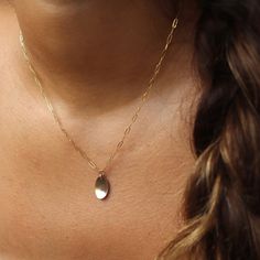 With a hammered oval charm pendant on our Narrow Links chain, the Olivia Necklace adds a touch of whimsy to any outfit. Want to create a set?! Pair this piece with our bestselling Olivia Ring! DETAILSPendant measures at 0.8"Available in 14", 16", or 18"Available in 14k Gold FillHypoallergenic, Nickel-Free, and Water Safe Dainty Oval Tarnish Resistant Jewelry, Yellow Gold Oval Charm Necklace With Adjustable Chain, Dainty Oval Charm Necklaces, Dainty Oval Necklaces With Charms, Dainty Oval Charms Necklaces, Oval Pendant Charms Jewelry In Brass, Brass Oval Pendant Jewelry With Charms, Dainty Oval Link Charm Necklace For Gift, Dainty Oval Sterling Silver Charm Necklaces