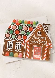 A diecut card in shape of gingerbread house, text reads Seasons Greetings. Christmas Card Competition, 3d Xmas Cards, Gingerbread House Canvas Paintings, Kids Holiday Cards, Vintage Gingerbread House Illustration, Gingerbread Christmas Cards Handmade, Gingerbread Party Invitations, Homade Christmas Card, Colored Pencil Christmas Cards