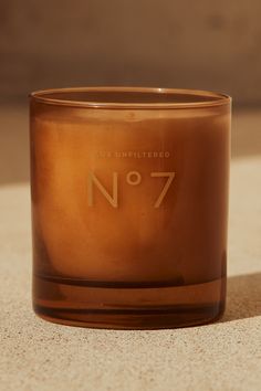 a brown candle sitting on top of a table