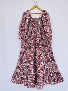 "Cotton maxi, hand block print dress, red printed dress, boho dress, boho maxi, long maxi, smocking maxi dress, bobbin dresses, cotton dresses, vintage gown, smocked maxi, hippie dresses, gauze maxi, gift for her, gift for mom, Christmas gift, festival wear, customised dresses,  fast shipping, summer dress, red flower dress Feel beautiful and confident throughout your days wearing our block printed outfits, made with high quality soft and breathable cotton fabric.  The print on the dress is known as \"BLOCK PRINT\" which is centuries old technique of Indian textile carried out  by local artisans of Jaipur (INDIA) MEASUREMENTS (in inches): Size XXS-: Bust- 34″ | Shoulder- 13.5″ | Length- 51″ Size XS-: Bust- 36″ | Shoulder- 14″ | Length- 51″ Size S-: Bust- 38″ | Shoulder- 14.5″ | Length- 51″ Traditional Boho Maxi Dress With Floral Print, Red Bohemian Floral Dress, Traditional Maxi Dress With Floral Print, Cotton Smocked Maxi Dress, Red Bohemian Maxi Dress With Batik Print, Red Batik Print Maxi Dress, Red Bohemian Dress With Kalamkari Print, Bohemian Red Dress With Kalamkari Print, Bohemian Red Floor-length Midi Dress