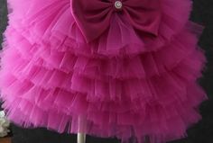 Playful Design: Features multiple layers of soft tulle for a voluminous and fun look. Comfortable Fit: Designed with a fitted bodice and a flattering silhouette. Perfect for Parties: Ideal for birthdays, parties, and other special occasions. Twirl-Worthy: The tulle layers create a skirt that's perfect for twirling. High-Quality Material: Made from soft, durable tulle for lasting wear. Available Sizes: Offered in various sizes to fit girls of different ages. Versatile Style: Suitable for a range Elegant Purple Sleeveless Tutu Dress, Elegant Sleeveless Purple Tutu Dress, Pink Tulle Tutu Ball Gown Dress, Pink Ball Gown Tutu Dress, Pink Tulle Tutu Dress In Ball Gown Shape, Purple Tulle Dress With Ruffles, Pink Tulle Ball Gown For Summer, Summer Pink Tulle Ball Gown, Spring Wedding Tiered Tutu Dress