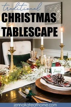 a christmas table setting with candles and place settings