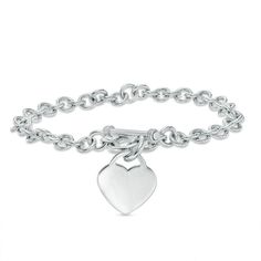 Simple, meaningful and so stylish, this darling heart charm bracelet is certain to win hers. Fashioned in sleek sterling silver, this rolo chain bracelet is finished with a lovely heart-shaped dangle charm. A look she'll treasure, this 7.25-inch bracelet is polished to a brilliant shine and secures with a toggle clasp. Classic Sterling Silver Charm Bracelet With Heart, Classic Silver Heart Bracelet, Elegant Everyday Sterling Silver Bracelet With Heart Charm, Classic Heart Charm Bracelet, Elegant Sterling Silver Bracelet With Heart Charm For Everyday, Elegant Heart Charm Bracelet With Sterling Silver Clasp, Classic Sterling Silver Heart Charm Bracelet, Classic Sterling Silver Heart Bracelet For Valentine's Day, White Gold Classic Heart Charm Bracelet