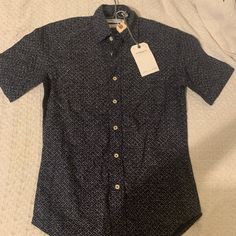 A Never-Worn Brooklyn Tailors Patterned Navy Button-Up Originally Priced At $160. Blue Slim Fit Shirt With Button Closure, Navy Cotton Top For Semi-formal Occasions, Navy Cotton Tops For Semi-formal Occasions, Blue Slim Fit Shirt With Buttons, Slim Fit Blue Shirt With Buttons, Blue Slim Fit Shirt, Semi-formal Slim Fit Tops With Button Closure, Slim Fit Button Closure Top For Semi-formal, Navy Button-up Business Casual Shirt