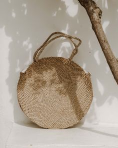 Experience the epitome of eco-conscious elegance with our Natural Grass Tote Bag, thoughtfully handcrafted to seamlessly house all your essentials while exuding an airy and environmentally-conscious charm. Crafted from authentic Balinese grass, each piece carries the essence of traditional island craftsmanship. Whether you're embarking on weekend getaways or leisurely strolls, this generously sized, round tote bag provides ample space for your belongings, ensuring you're always well-prepared in an eco-friendly manner. How it's Made Did you know it takes ONE MONTH to make one Rattan bag? That's because each of our Bali Bags is handcrafted from start to finish by artisans in Bali. ◖Made from a vine native to the volcanic foothills on the island of Bali. First, the stems are braided to create Eco-friendly Palm Leaf Bag With Open Weave, Eco-friendly Natural Straw Bag, Eco-friendly Beige Beach Bag With Round Handle, Jute Straw Bag With Round Handle For Vacation, Vacation Jute Straw Bag With Round Handle, Eco-friendly Handwoven Natural Crochet Bag, Eco-friendly Beige Straw Bag With Round Handle, Vacation Bags With Round Handle In Jute, Vacation Jute Bag With Round Handle