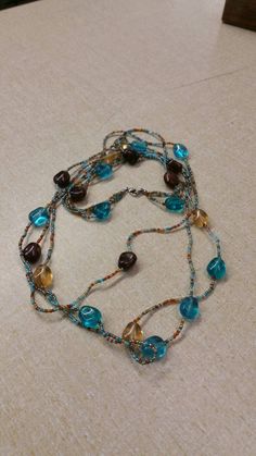 Boho Style, Blue, Gold and Brown Plastic Beaded, Triple Strand, 34 inch Necklace, Costume Jewelry, Fashion Accessory This is a nice find and very decorative. Priced to sell. Check out our shop for monthly specials. We have a variety of items for every taste. Combine several of our items together to save on shipping. If you have any questions please do not hesitate to ask. I will ship outside of the US, just request a quote. Happy Shopping. I will work around the priority mail price. Just send me your zip code and I will get a quote. As shop owners we will do our best to describe any issues or problems with our items. Since we do sell vintage and antiques there may be some flaws. Please check out the pictures very carefully and feel free to ask any questions. All sales are final. With any g Blue Bohemian Long Necklace With Colorful Beads, Bohemian Long Blue Necklace With Colorful Beads, Bohemian Blue Long Necklace With Colorful Beads, Blue Beaded Chain Bohemian Necklace, Blue Bohemian Beaded Chain Long Necklace, Blue Long Necklace With Colorful Beads, Blue Long Necklace With Colorful Round Beads, Beaded Multi-strand Necklace For Beach, Blue Beaded Long Necklace With Round Beads