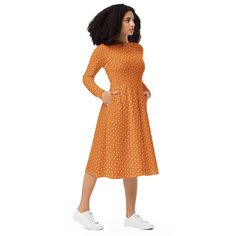 This long sleeve midi dress has a comfy yet flattering silhouette since it's fitted on the waist and has a flared bottom part. Plus, pockets! Style it for a fancy night out or dress down for a more casual look!  D E T A I L S - 95% polyester, 5% elastane (fabric composition may vary by 1%) - Fabric weight: 6.19 oz/yd2 (210 g/m2) (weight may vary by 5%) - Premium knit mid-weight jersey fabric - Midi length - Long sleeves - Side pockets - Boat neckline - Fitted on the waist - Flared bottom Model i Spring Polka Dot Long Sleeve Midi Dress, Spring Long Sleeve Polka Dot Midi Dress, Casual Long Sleeve Polka Dot Midi Dress, Orange Long Sleeve Midi Dress For Spring, Casual Orange Long Sleeve Midi Dress, Modest Fitted Knee-length Long Sleeve Dress, Fall Clothing, Fall Dress, Autumn Dress