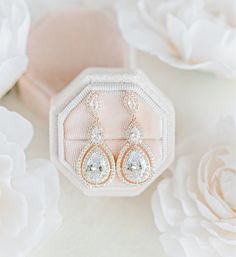 These gorgeous crystal wedding drop earrings in a teardrop design are head-turners and a magical wedding accessory for your big day! #brides #bridalstyle #weddingaccessories #winkofpinkshop #weddingearrings #bridaljewelry #bridalearrings #rosegold #earrings #weddingjewelry Rose Gold Cubic Zirconia Drop Bridal Earrings, Elegant Rose Gold Teardrop Earrings With Cubic Zirconia, Rose Gold Teardrop Cubic Zirconia Earrings, Rose Gold Cubic Zirconia Teardrop Earrings, Rose Gold Diamond Crystal Earrings For Wedding, Rose Gold Teardrop Bridal Earrings For Anniversary, Rose Gold Pear-shaped Teardrop Earrings For Wedding, Rose Gold Crystal Teardrop Earrings, Rose Gold Cubic Zirconia Teardrop Earrings For Gift