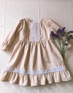 Vintage, handmade with beige fabric and white lace. 100 % cotton fabric. Very comfy for your baby to wear. Cute and protective as well. Protective from wind.  *Comes in sizes 0-3 months and older, up to 4 years old Handmade in the USA *IF YOU BUY SET, you get $3.50 OFF!! Beige Dress, Old Dresses, Beige Dresses, Beige Fabric, Blue Polka Dots, Baby Wearing, Girls Clothing, Cotton Dresses, 3 Months