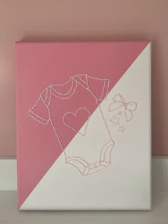 a pink and white painting on the wall