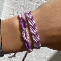 a close up of a person wearing two bracelets