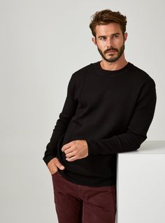 Our crewneck sweater is the perfect addition to your fashion collection. It's soft, stretchy, and breathable fabric makes it that much better. Details Model is 6'1" and wears a size medium. Care: Machine wash cold with similar colors on delicate cycle. Do not bleach. Do not tumble dry. Iron on low. Dry flat. Do not dry clean. Composition: 54.5% Viscose | 45.5% Polyester Black Stretch Sweater With Ribbed Cuffs, Black Stretch Sweater With Crew Neck, Black Stretch Crew Neck Sweater, Black Knit Sweatshirt With Ribbed Cuffs, Black Crew Neck Sweater For Fall, Black Knit Crew Neck Sweatshirt, Black Knit Sweatshirt For Layering, Casual Black Sweater For Layering, Black Knit Sweatshirt With Ribbed Collar