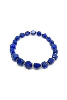 This brilliant Lapis Lazuli stretchy bracelet has been shaped into angled beads. Pair this bracelet with any outfit to add a 'pop' of beautiful blue. Lapis Lazuli dates back to 5000 B.C. and has been highly prized since ancient Babylonian and Egyptian times. The stone is mined in Chili, Siberia, Myanmar, and the United States. Lapis Lazuli, a manifestation stone, is excellent for meditation. It is believed to provide strength, wisdom, and truth. Measurements: 9" long Luxury Blue Lapis Lazuli Beaded Bracelets, Blue Gemstone Beads Stretch Bracelet, Adjustable Blue Stretch Bracelet With Gemstone Beads, Adjustable Blue Gemstone Beads Stretch Bracelet, Blue Stretch Bracelet With Polished Beads As Gift, Blue Spiritual Bracelets With Large Beads, Gift Blue Stretch Bracelet With Polished Beads, Adjustable Lapis Lazuli Beaded Bracelet With Faceted Beads, Blue Polished Beads Spiritual Stretch Bracelet