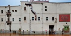 an old building that has been flooded with water and is being used as a museum