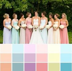 a group of women standing next to each other in front of trees with different colors