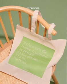 a tote bag sitting on top of a wooden chair