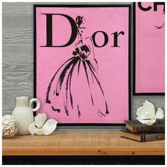 Dimensions: 20" H x 16" W x 1.18" D Material: MDF & Canvas Shape: Rectangular Color: Pink & Black Orientation: Vertical Includes: 1 Sawtooth Hanger Quantity: 1 Personalize your bedroom with glam elements, such as this Pink Glitter Dior Canvas Wall Decor. It features a sleek black frame and a pink glitter canvas background. The word "Dior" sits in the center in its classic font, and there is an outline of a stylish woman where the "I" should be. Use this dazzling piece to make your room even more trendy! Wall Decor Hobby Lobby, Canvas Background, Glitter Canvas, Classic Fonts, Word Wall Art, Framed Mirror Wall, Canvas Wall Decor, Mirror Wall Decor, Mirror Frames