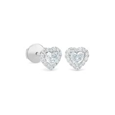 Feminine and romantic, these earrings feature two perfectly matching heart-shaped diamonds, ethically sourced and hand-selected for maximum brilliance. The hero diamonds are framed by shimmering halos of micropavé, for a total of ~0.60 carats. Unique yet understated, these earrings wear beautifully alongside other styles from the collection. Heart-shaped Vvs Clarity Diamond Earrings For Formal Occasions, White Gold Heart Earrings With Prong Setting, Classic Heart Cut Brilliant Earrings, White Gold Heart Cut Earrings With Prong Setting, Classic Double Heart White Gold Earrings, Classic Heart-shaped Brilliant Cut Earrings, Formal White Gold Heart Earrings With Cubic Zirconia, Classic Heart Earrings In Brilliant Cut Diamond White, Classic White Gold Double Heart Earrings