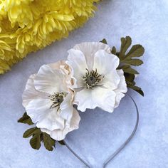 This beautiful cream and beige poppy flower headband comprises three large poppies, two on the front and one on the back. They are complimented by dark green poppy leaves and the design is secured to a silver headband using felt material to help it sit in place. This is a fab fascinator to wear for a trip to the races or to complete a summer wedding outfit. The height is: 5.5cm / 2.5in.  The design can be created to sit on either side of the head so just ask if you would like it on the opposite Poppy Leaves, Wedding Hats For Guests, Headband Summer, Natural Hair Accessories, Soul Design, Church Hat, Bride Headpiece, Silver Headband, Wedding Fascinators