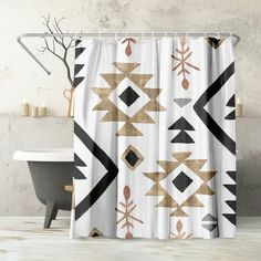 a white shower curtain with black and gold geometric designs on the outside, in front of a bathtub