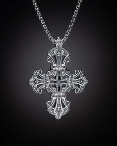 The Tranquility is a sculpted cross infused with pattern and texture inspired by medieval armor. Crafted from solid sterling silver, Tranquility hangs on a sterling silver rounded box chain at 2.6mm diameter with a lobster clasp. Materials Sterling Silver Features & Specs Pendant dimensions: 47 x 34 x 7mm Silver Gothic Box Chain Jewelry, Gothic Sterling Silver Jewelry With Polished Finish, Gothic Sterling Silver Jewelry, Luxury Sterling Silver Cross Necklace, Silver Cross Necklace With Large Pendant, Gothic Cross Pendant Necklace With Engraving, Gothic Sterling Silver Jewelry With Intricate Design, Silver Cross Jewelry Symbolic Style, Gothic Silver Box Chain Necklace