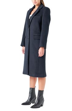 Feel the polish of this woolly longline coat designed in a tailored two-button fit. Front button closure Notched lapels Nonfunctional four-button cuffs Chest welt pockets; front flap pockets Back vent Lined 50% wool, 50% polyester Dry clean Imported Double-breasted Wool Coat With Button Cuffs For Work, Chic Wool Coat With Button Cuffs And Notch Lapel, Solid Wool Coat With Double Button Closure For Work, Solid Wool Coat For Work, Solid Wool Coat With Buttons For Work, Workwear Wool Coat With Buttons, Structured Pea Coat With Button Closure For Work, Structured Pea Coat For Workwear, Winter Wool Coat For Work With Button Closure