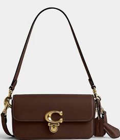 COACH Glove-Tanned Leather Studio Baguette Shoulder Bag | Dillard's Cognac Rectangular Bag With Turn-lock Closure, Leather Satchel Baguette Bag With Branded Hardware, Brown Baguette Bag With Branded Hardware For Travel, Classic Travel Baguette Bag With Branded Hardware, Classic Brown Baguette Bag With Top Handle, Timeless Brown Satchel With Branded Hardware, Brown Baguette Shoulder Bag With Branded Hardware, Brown Shoulder Baguette Bag With Branded Hardware, Classic Shoulder Bag With Branded Hardware And Flap