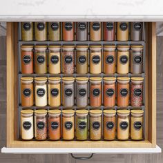 an organized spice rack with spices and seasonings