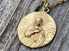 This is a solid gold bronze antique replica of a very rare Assumption of Mary medal from France. I am blessed to own this original and be able to share with you. The photographs do not capture the true beauty of this piece of art. Amazing depth and details! The oxidation and antiquing process highlights the gorgeous details. If you rub your fingers over the medal, Our Lady's face and body are very pronounced. The antique gold 2x3mm cable chain is 20 inches long and the medal is 1 inch round. A l Assumption Of Mary, Cross Medal, Opening An Etsy Shop, I Am Blessed, Medallion Necklace, French Antique, Rolo Chain, Oils For Skin, Gold Chain Necklace