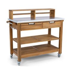 a wooden kitchen island with two drawers on wheels